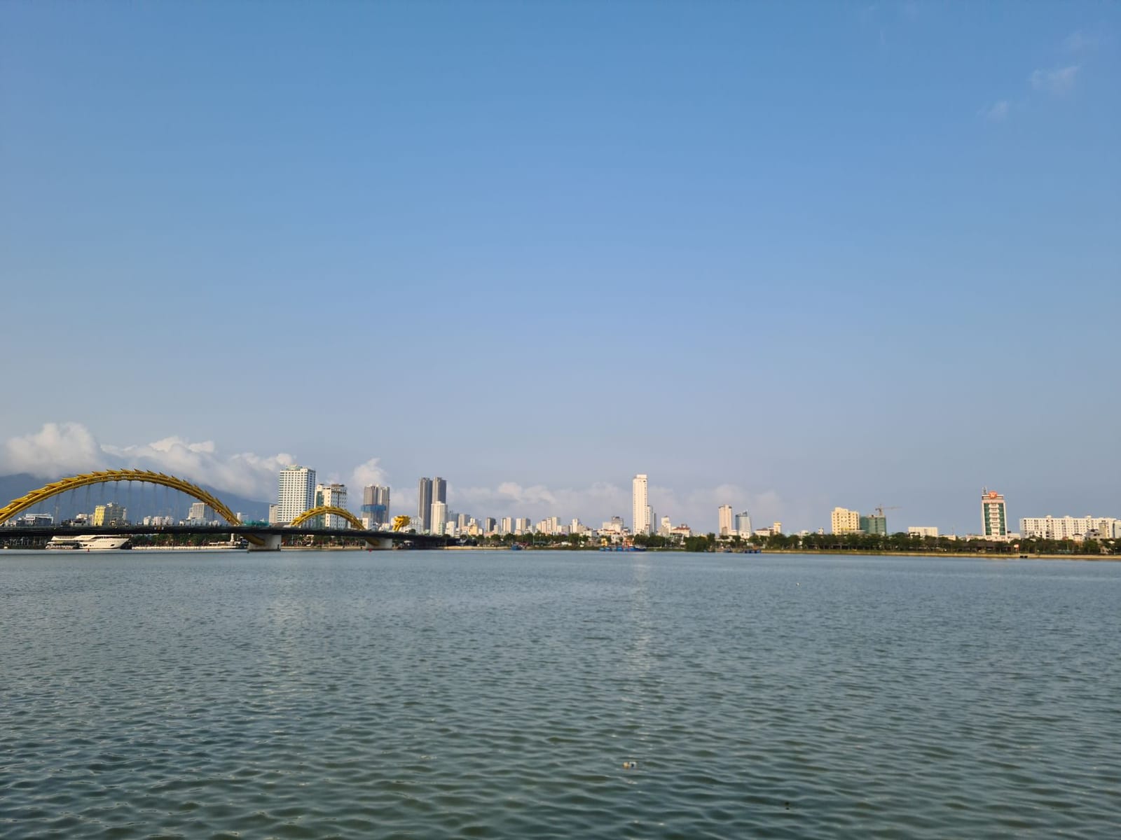 Da Nang's Dragon Bridge over the Han River on a clear, dry-season day