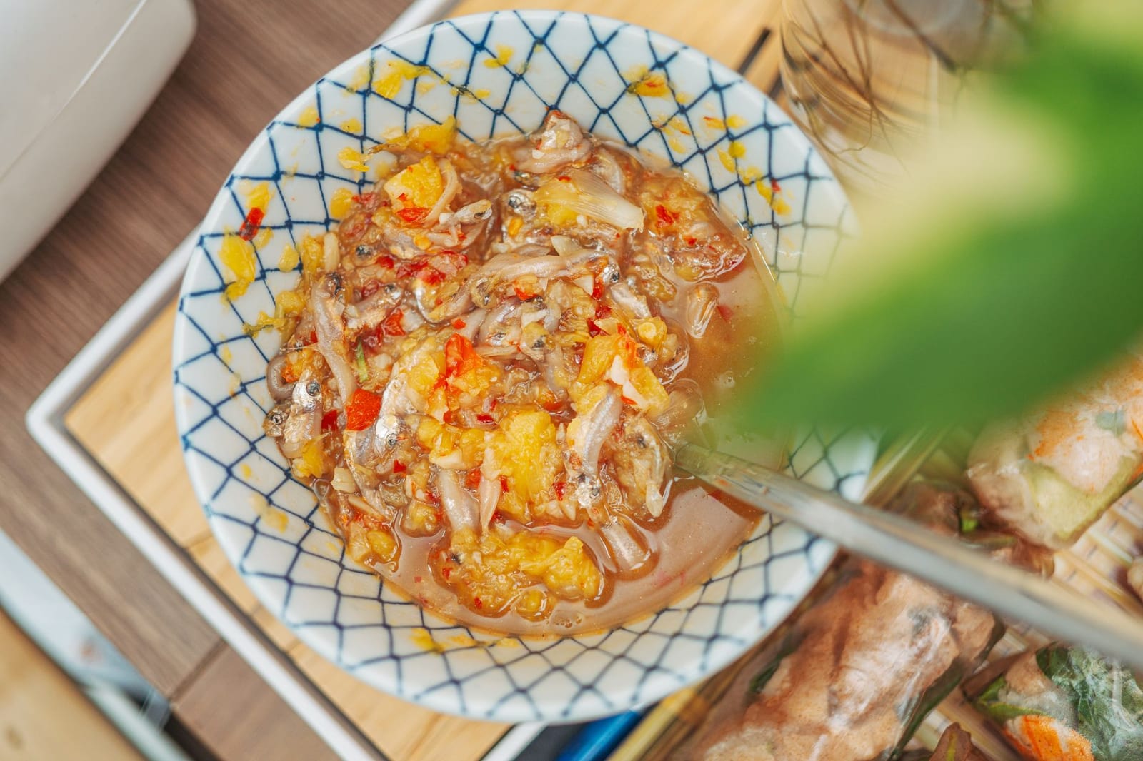 A small bowl of mắm nêm fermented anchovy sauce with chili, garlic and pineapple