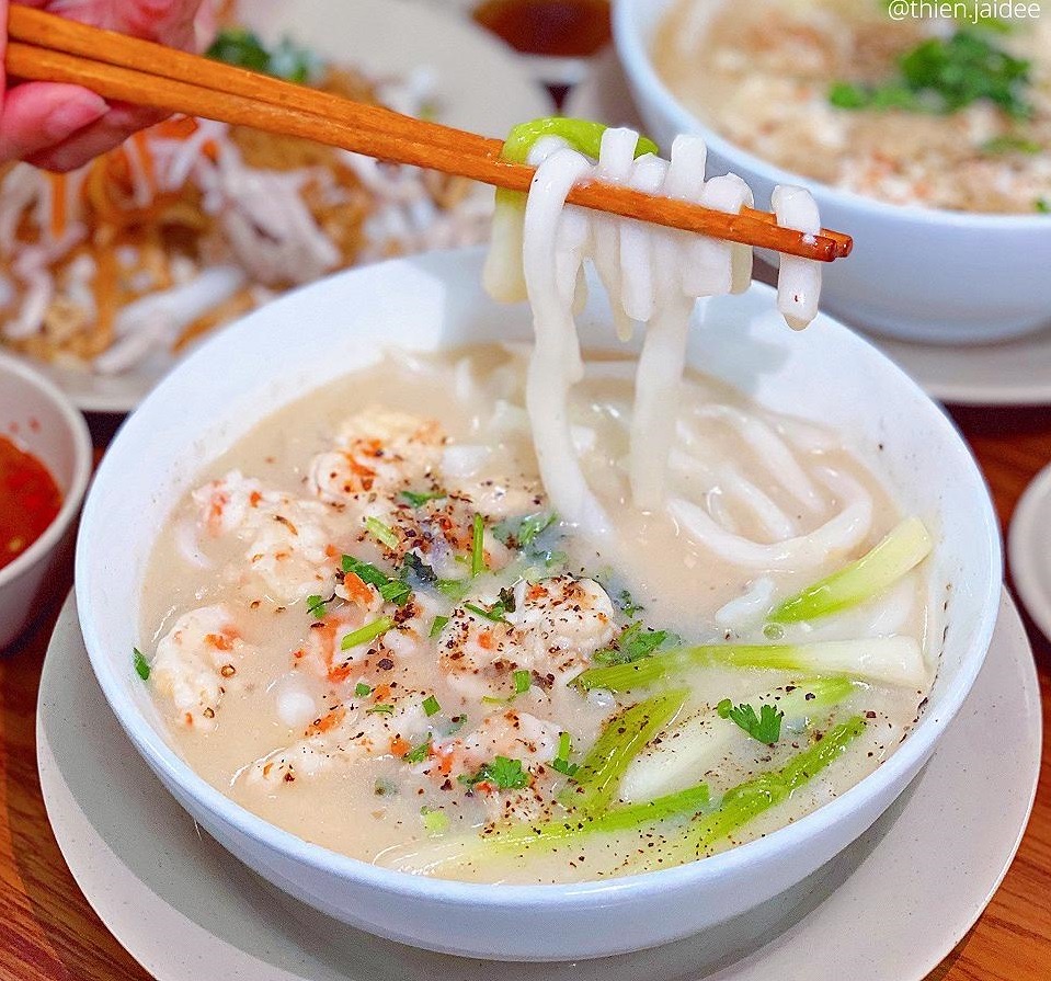 Close-up of thick, chewy semi-transparent bánh canh tapioca noodles