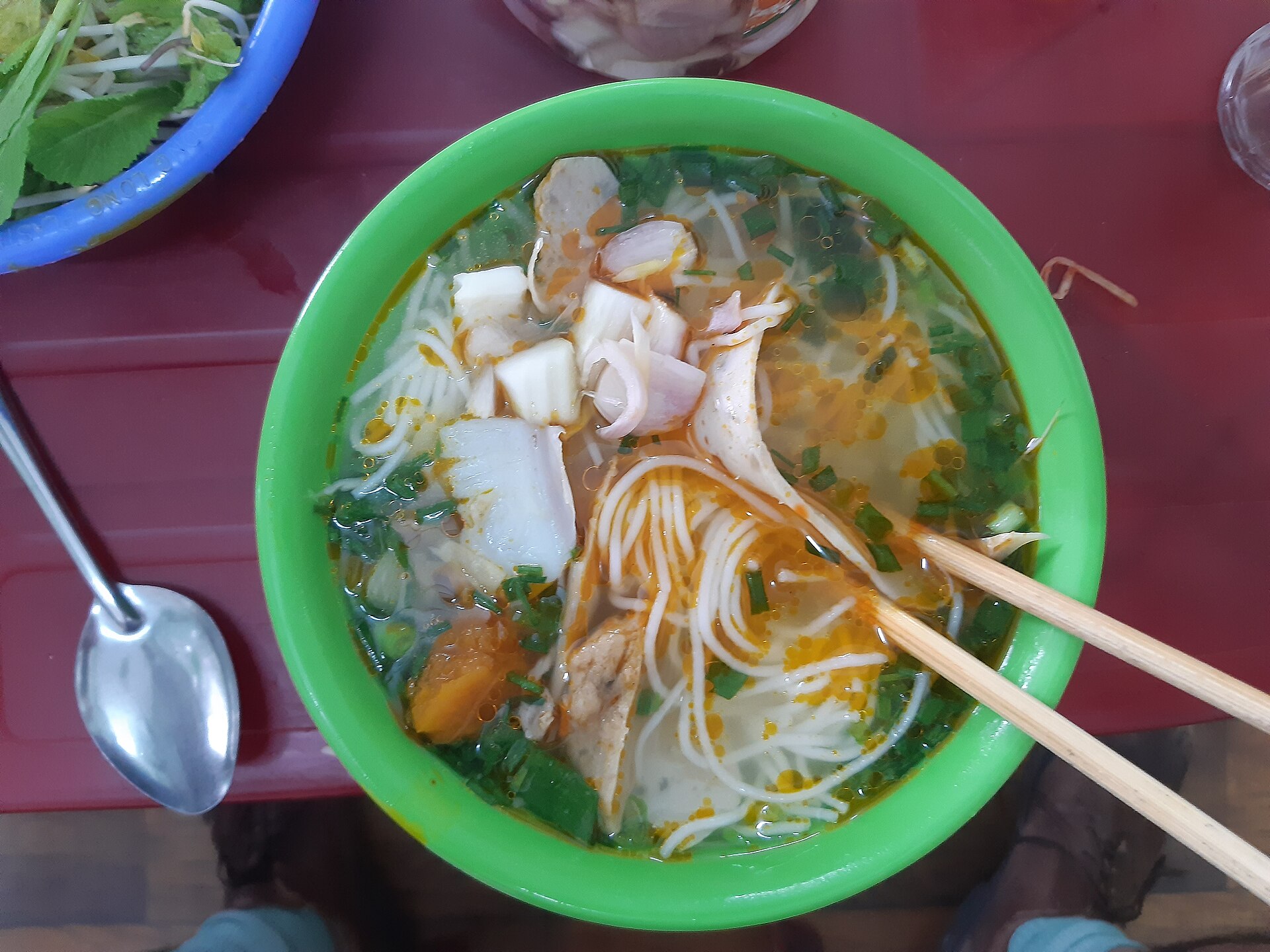 A bowl of Da Nang bún chả cá with clear broth, rice vermicelli and fried and steamed fish cake