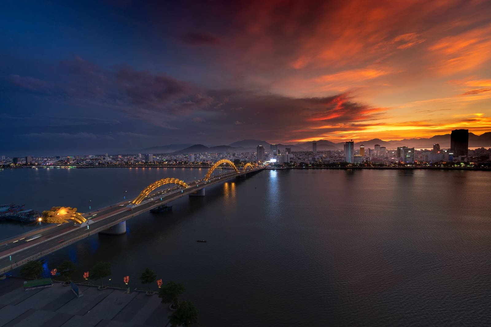 The illuminated Dragon Bridge over the Han River, a popular free fireworks viewing area in Da Nang