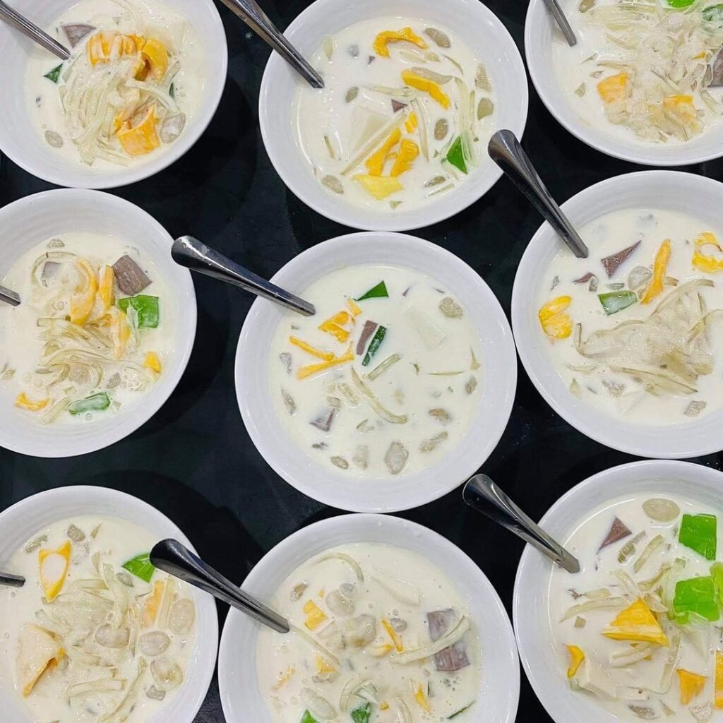 Rows of chè thái bowls at Chè Liên, loaded with jackfruit, jelly and coconut milk.