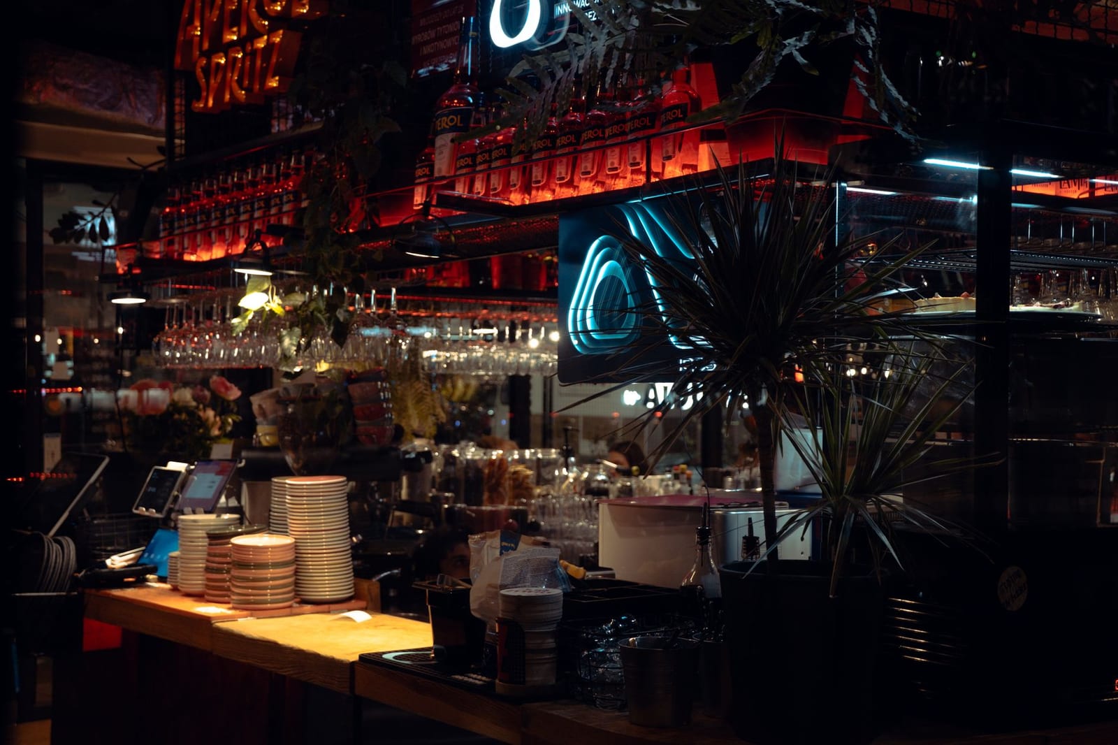 Cocktails and neon lights at an underground dance bar.