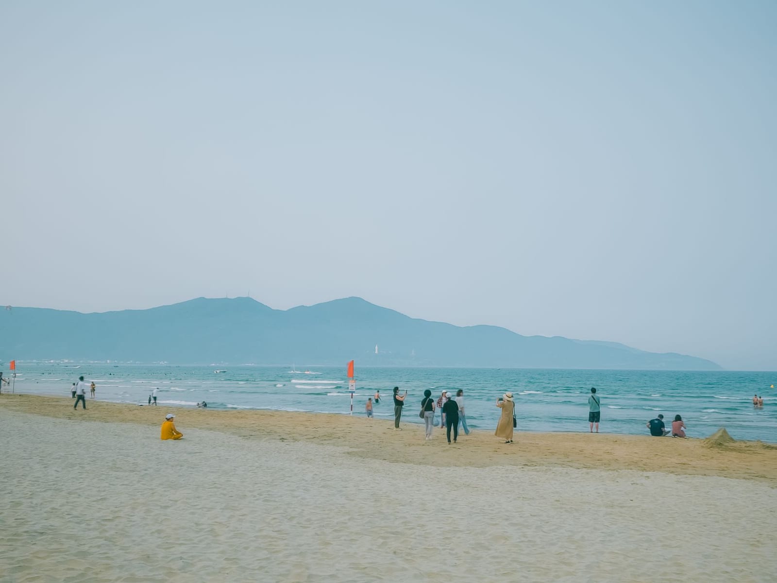 The long sandy stretch and palm-lined path of My Khe Beach, Da Nang.