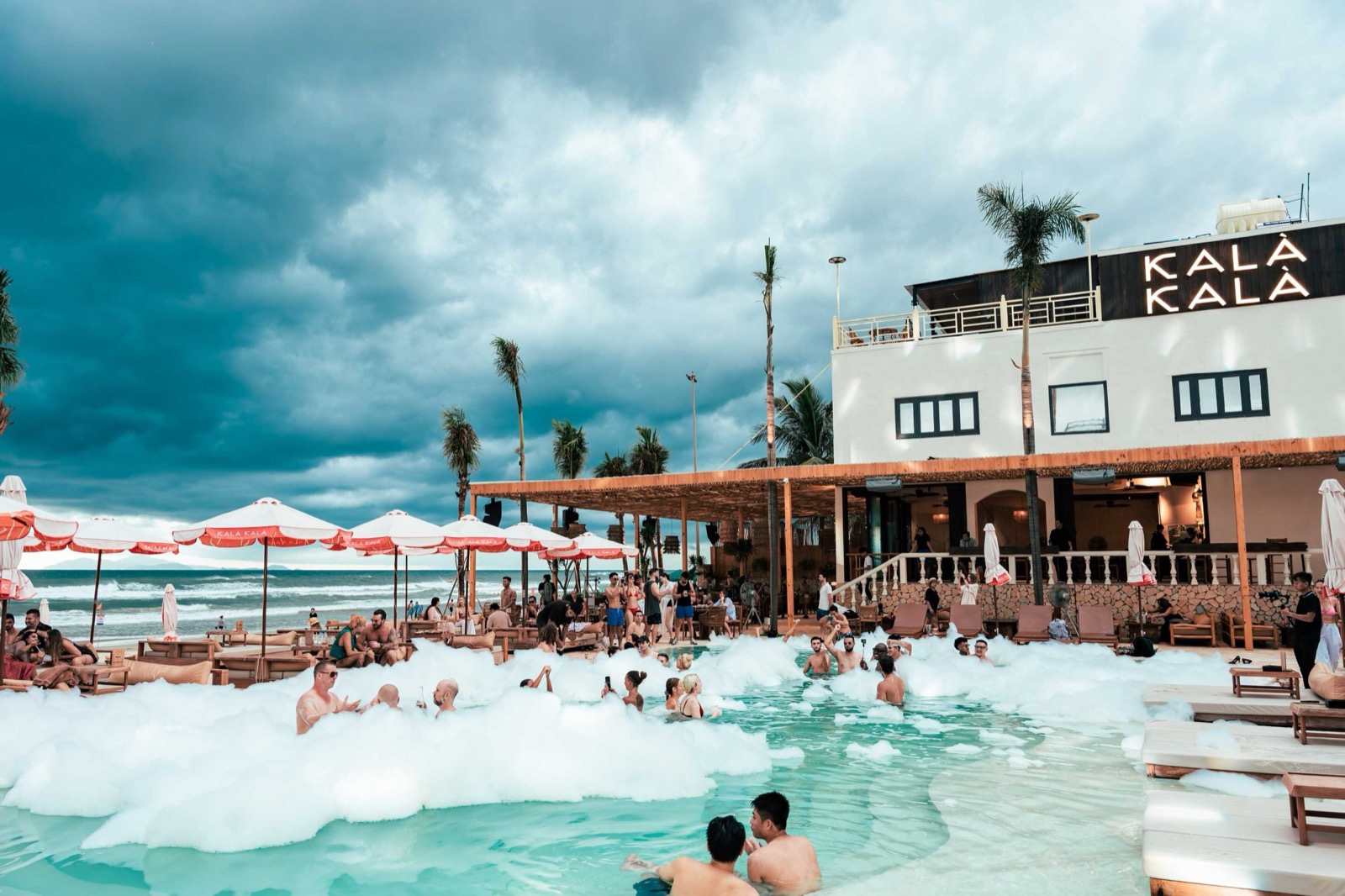 Foam party in the pool at Kalà Kalà Beach Club on My Khe Beach, Da Nang.
