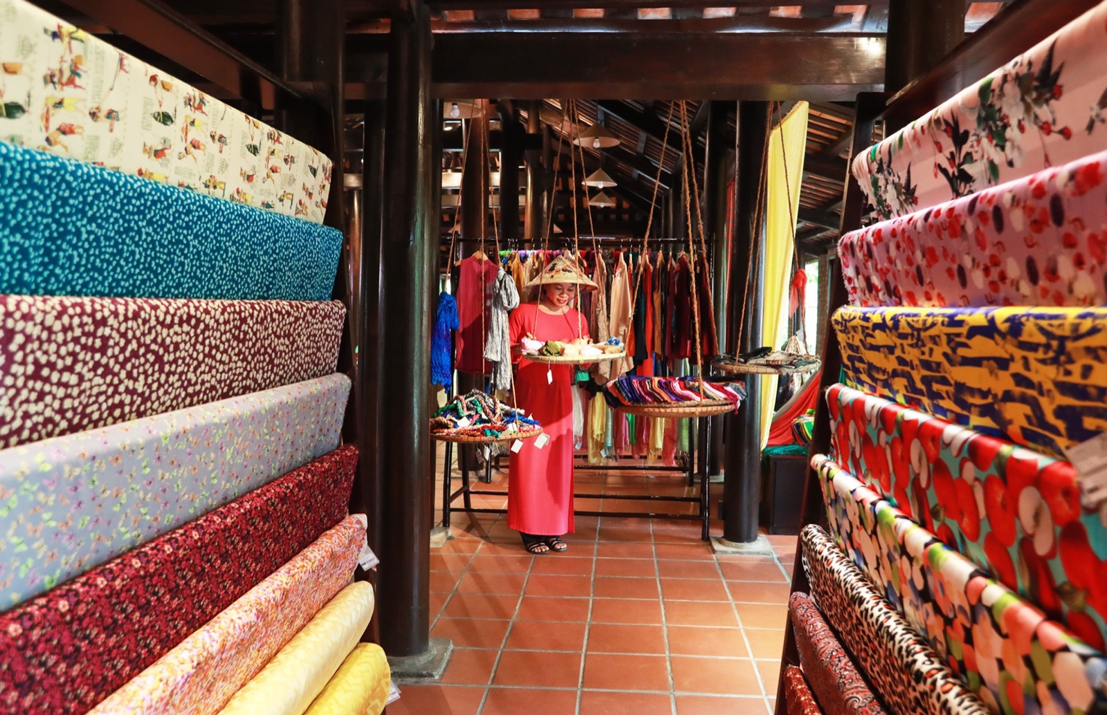 Walls of fabric to choose from at a Hội An tailor.