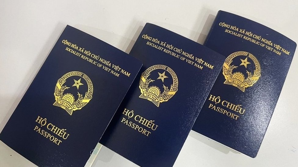 Vietnamese passports, illustrating how some Da Nang hospitals hold a passport as collateral until the bill is paid