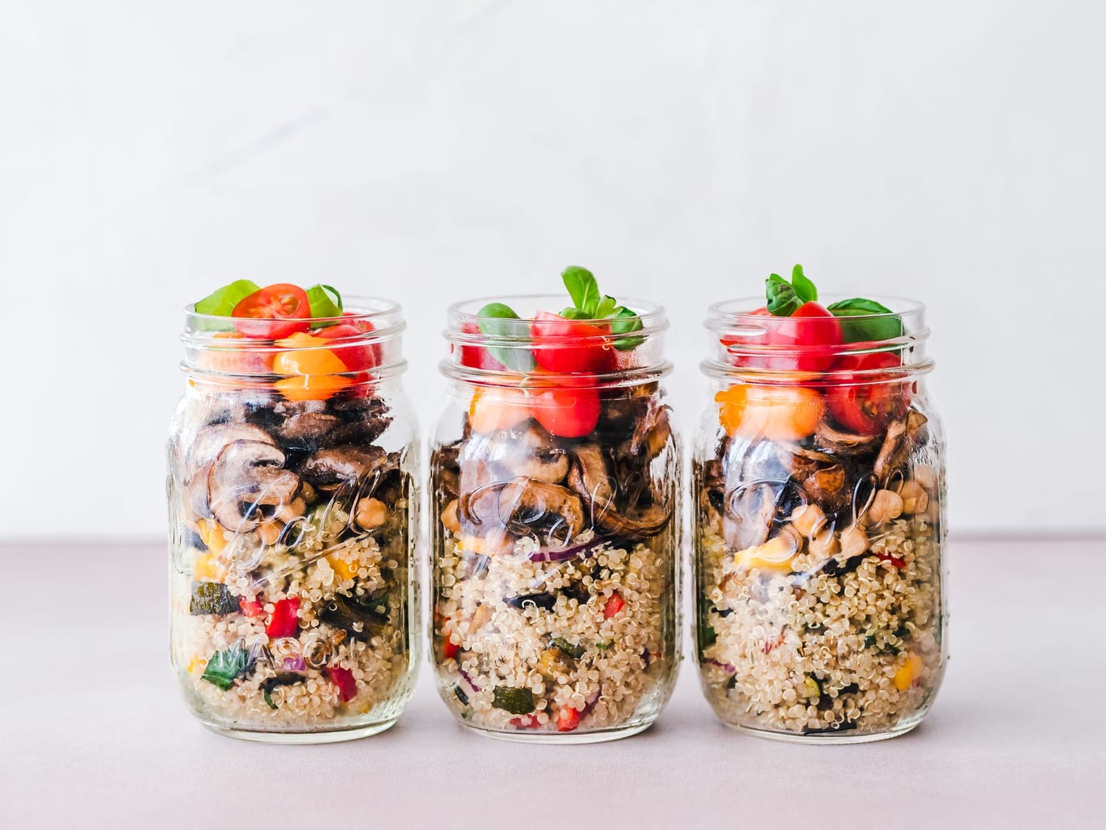 Jars of imported organic grains and pantry staples on display.