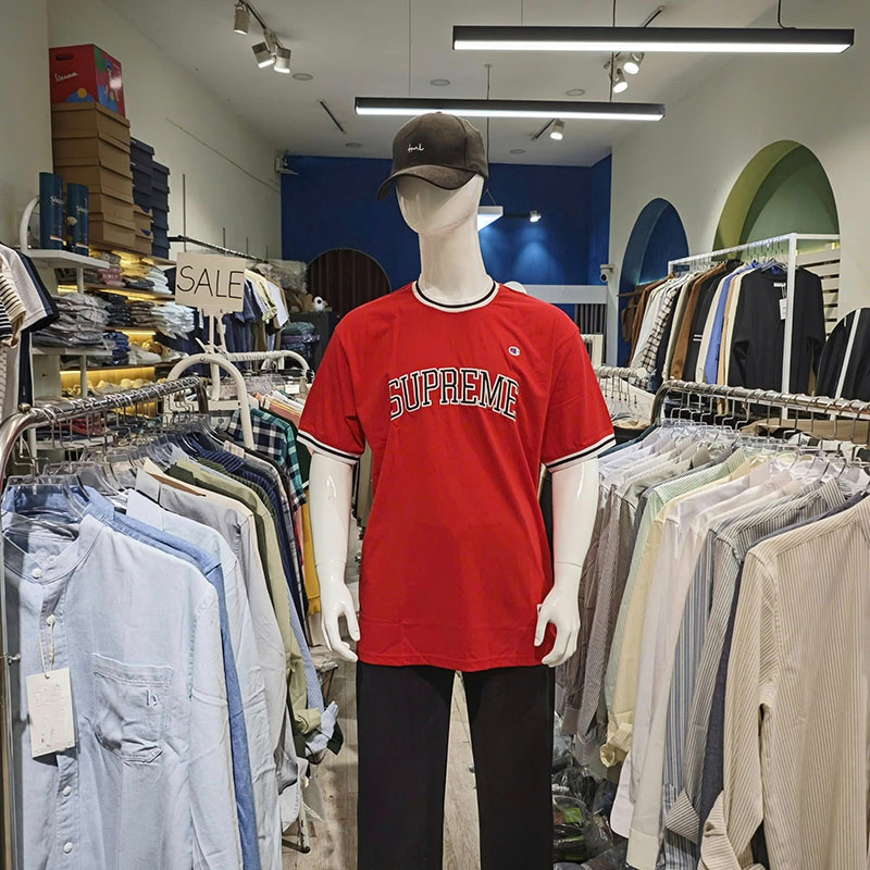 Streetwear hanging on display inside a Da Nang clothing store