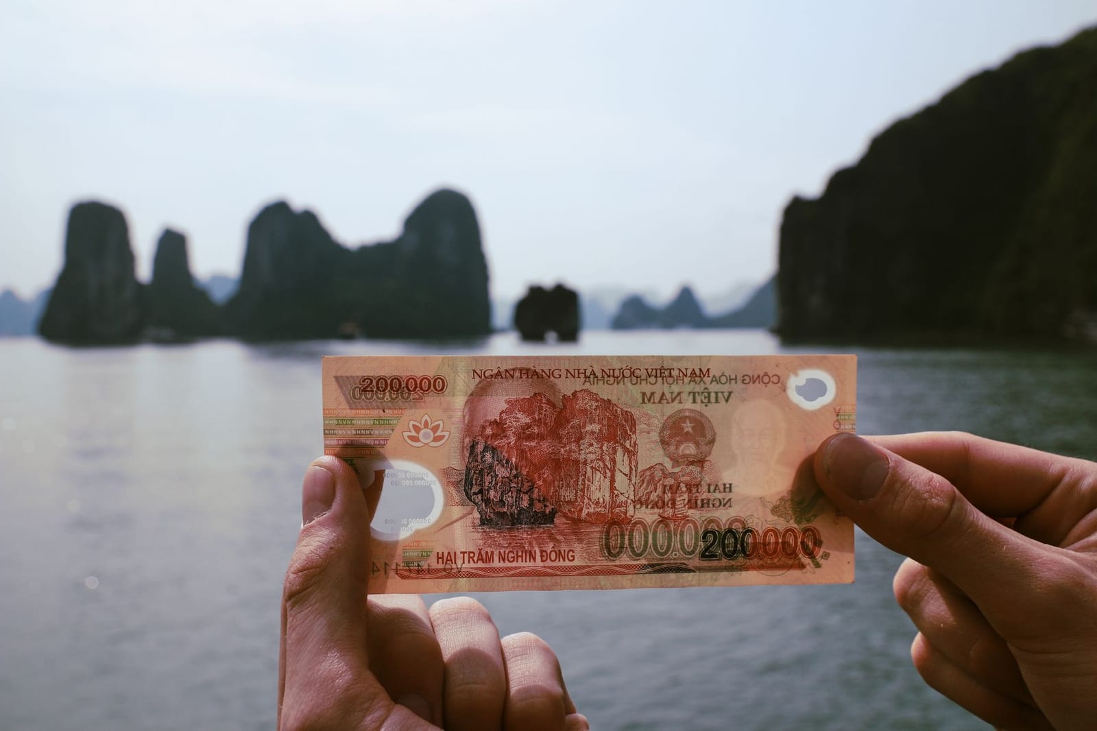A fan of Vietnamese đồng banknotes — the cash you will use for tips.