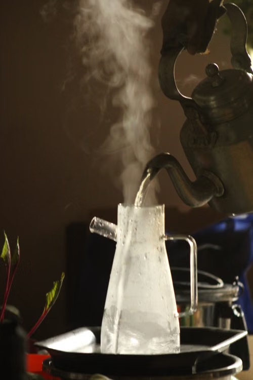 Water at a rolling boil — one minute at a full boil is enough to kill waterborne germs.