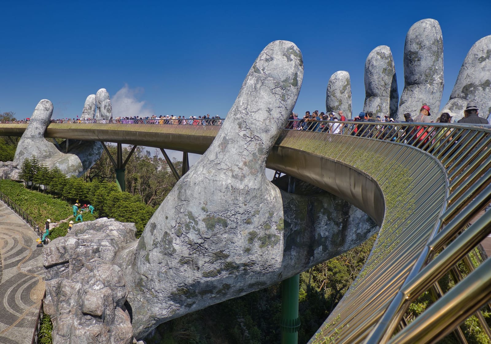 The Golden Bridge held by giant stone hands at Ba Na Hills.