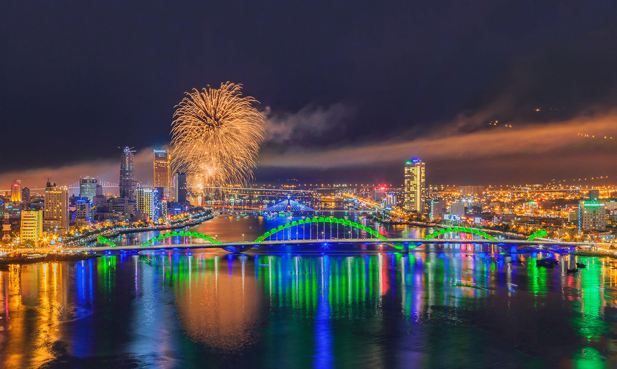 The illuminated Dragon Bridge over the Han River, a popular free fireworks viewing spot in Da Nang