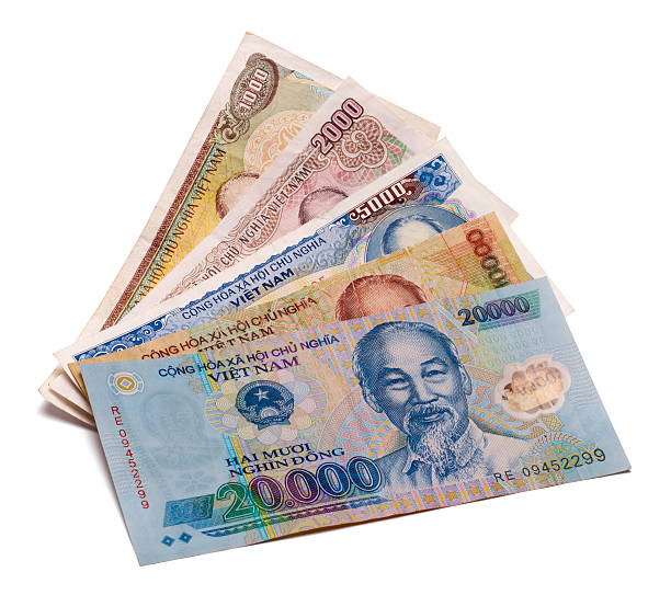 Small-denomination Vietnamese đồng notes counted out on a table — the kind of small change locals use for a tip